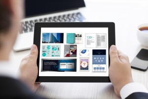 businessman holding a tablet with isolated screen in the office